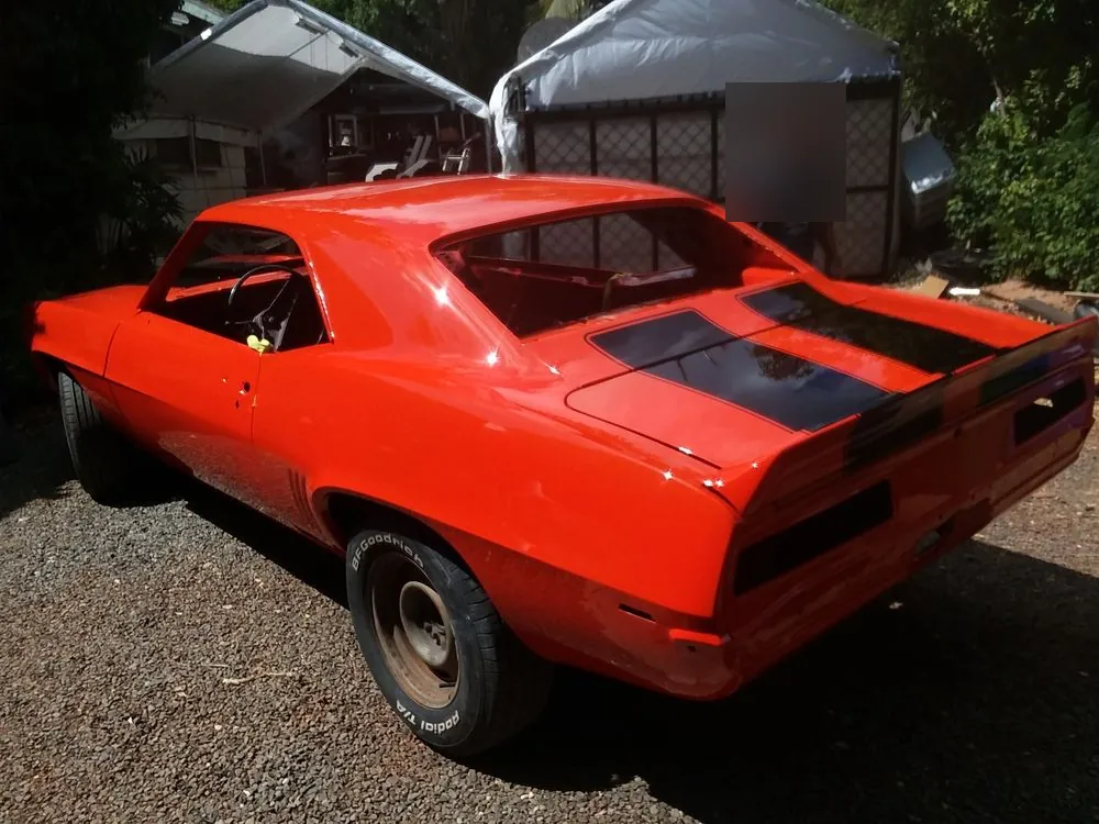 Red Chevrolet Camaro — A classic Camaro with new body panels, painted inside and out.