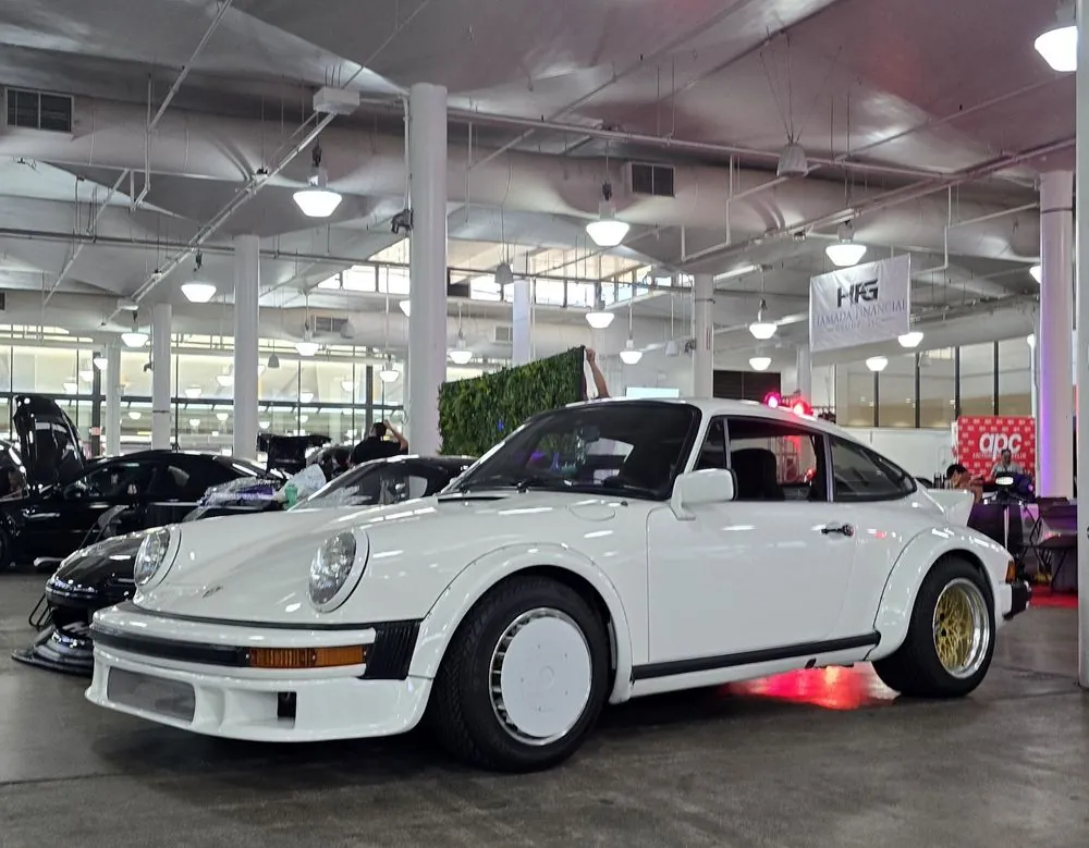 Porsche 911 in Grand Prix White — Stripped to bare metal, rust repaired, primed and repainted.