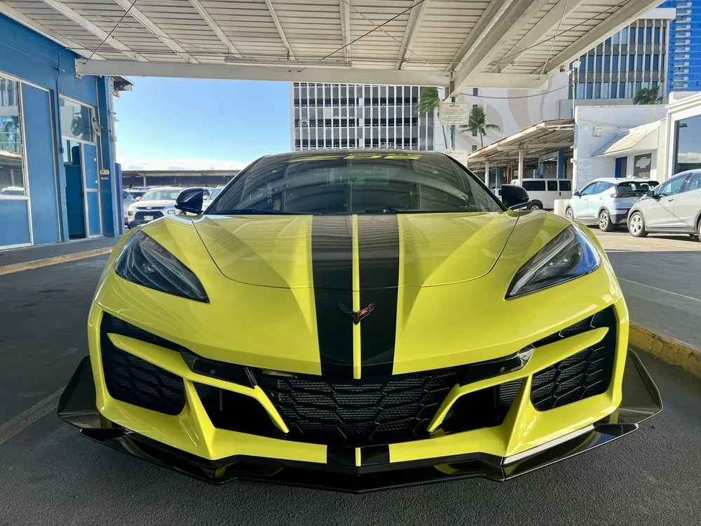 Corvette Z06 in Accelerate Yellow — Front fascia painted to match Accelerate Yellow, with the lower section finished in black.