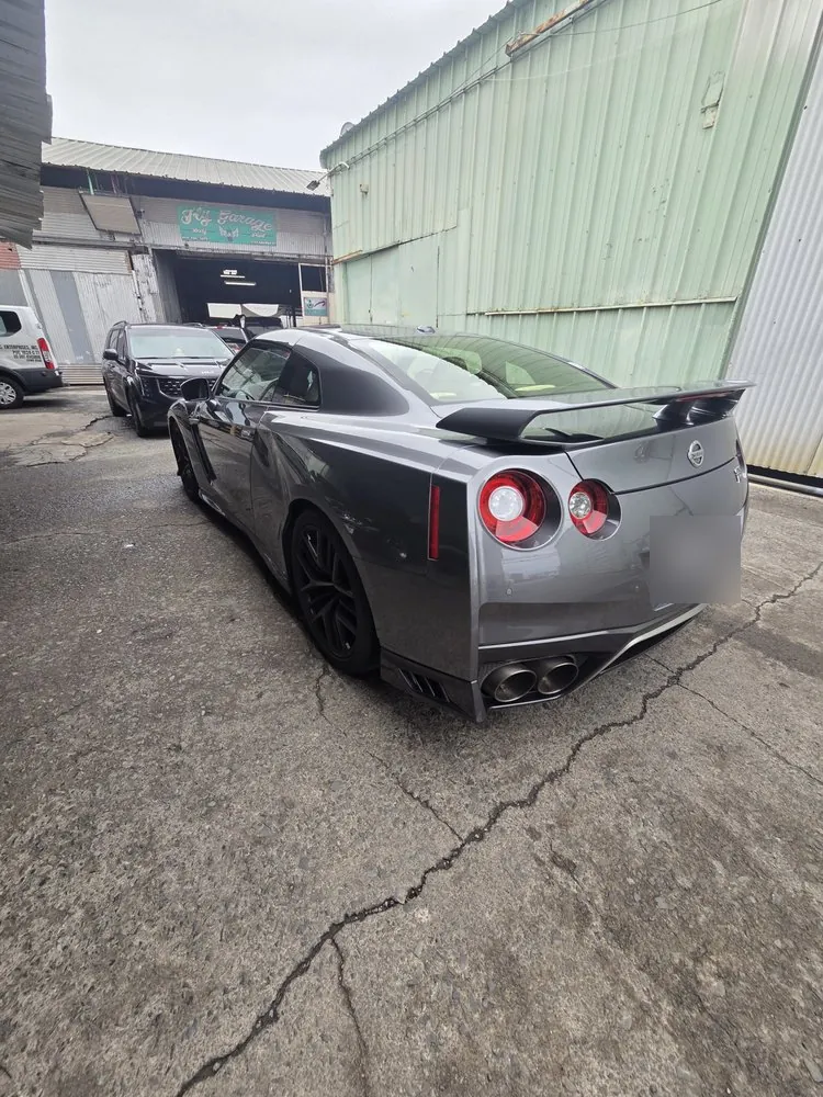 Grey Nissan GT-R — A GT-R at the shop for body and paint work.