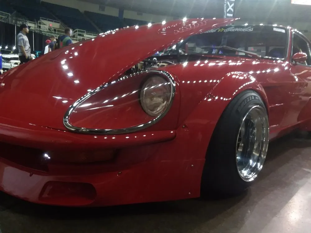 Red Datsun Z show car — The red Datsun under the lights at a car show.