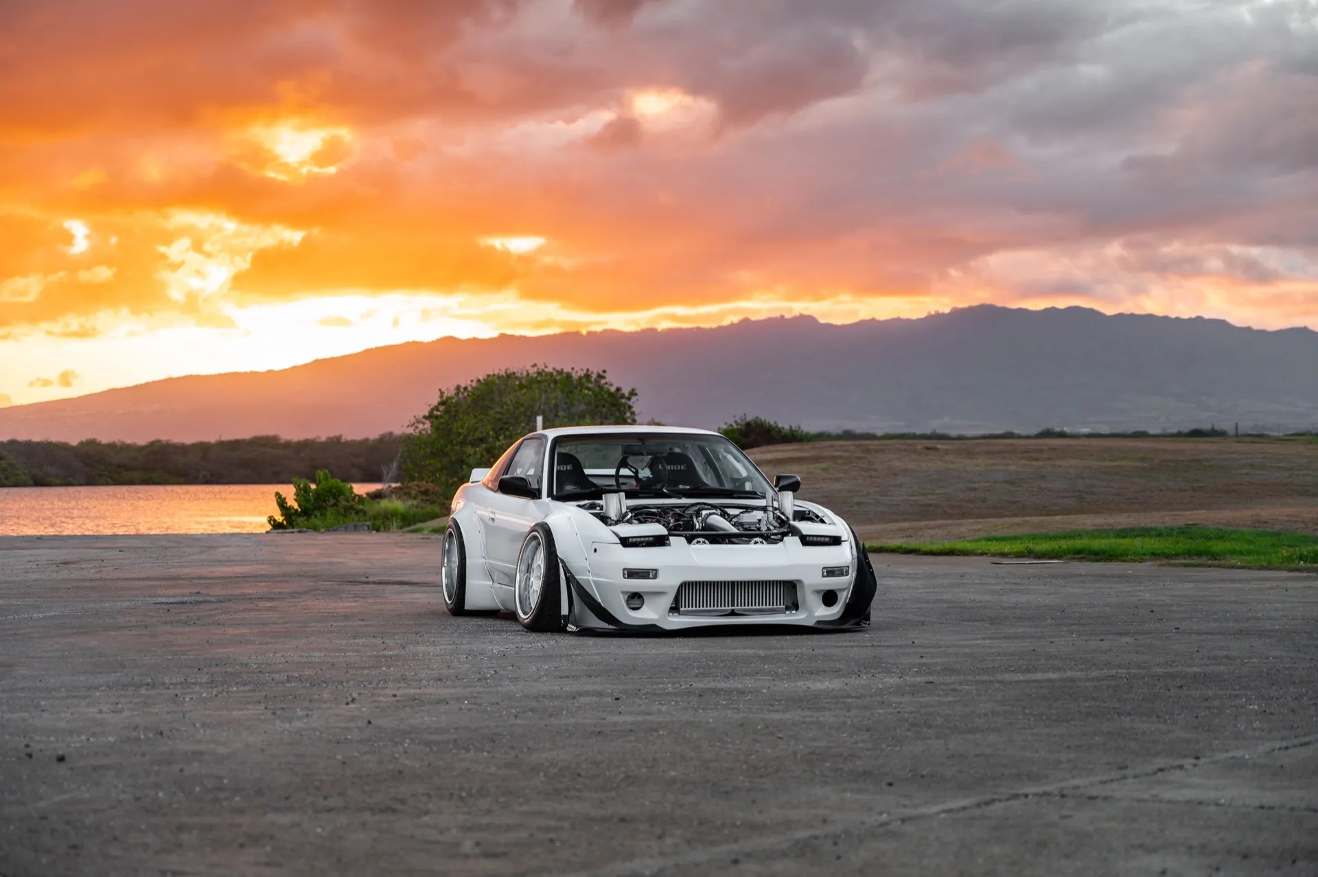 White Nissan S13 with an LSX twin-turbo build at sunset